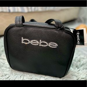Travel Bag. Includes 2  - 1.6oz/50ml travel toiletry bottles.